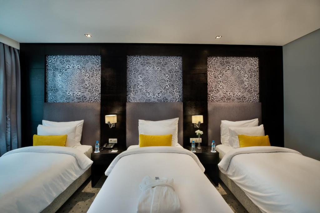 Letto o letti in una camera di ODYSSEE Boutique Hotel Casablanca
