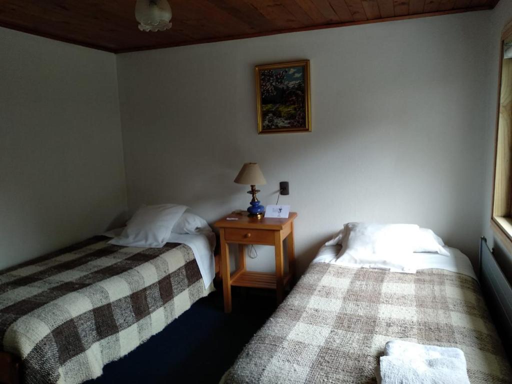 Postel nebo postele na pokoji v ubytování Hotel Mi Casa