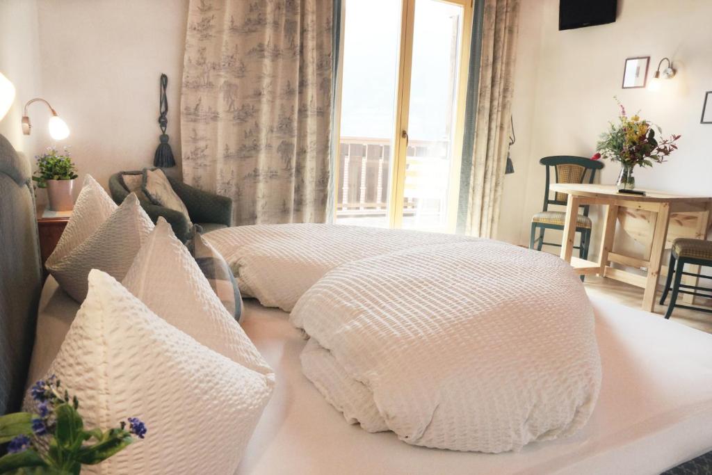 Postel nebo postele na pokoji v ubytování Alpenresidenz Maria