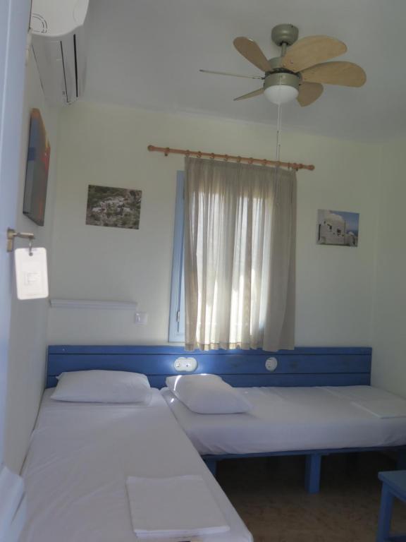 Postel nebo postele na pokoji v ubytování Kaminaki Amorgos