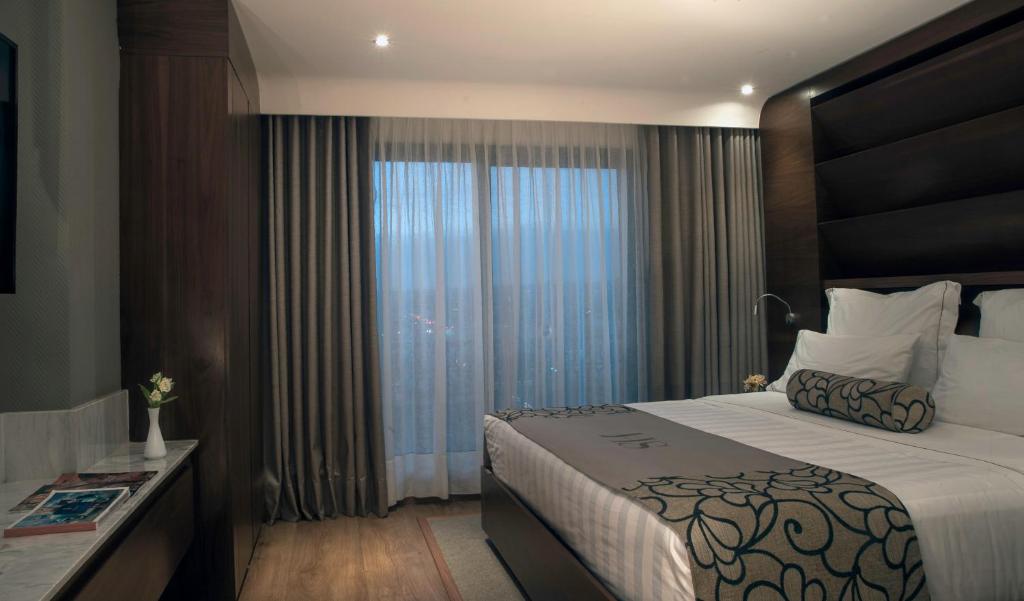 Postel nebo postele na pokoji v ubytování HS HOTSSON Hotel Leon