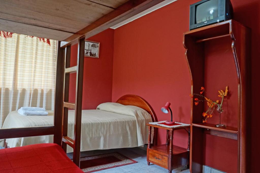 Postel nebo postele na pokoji v ubytování Mindo Real