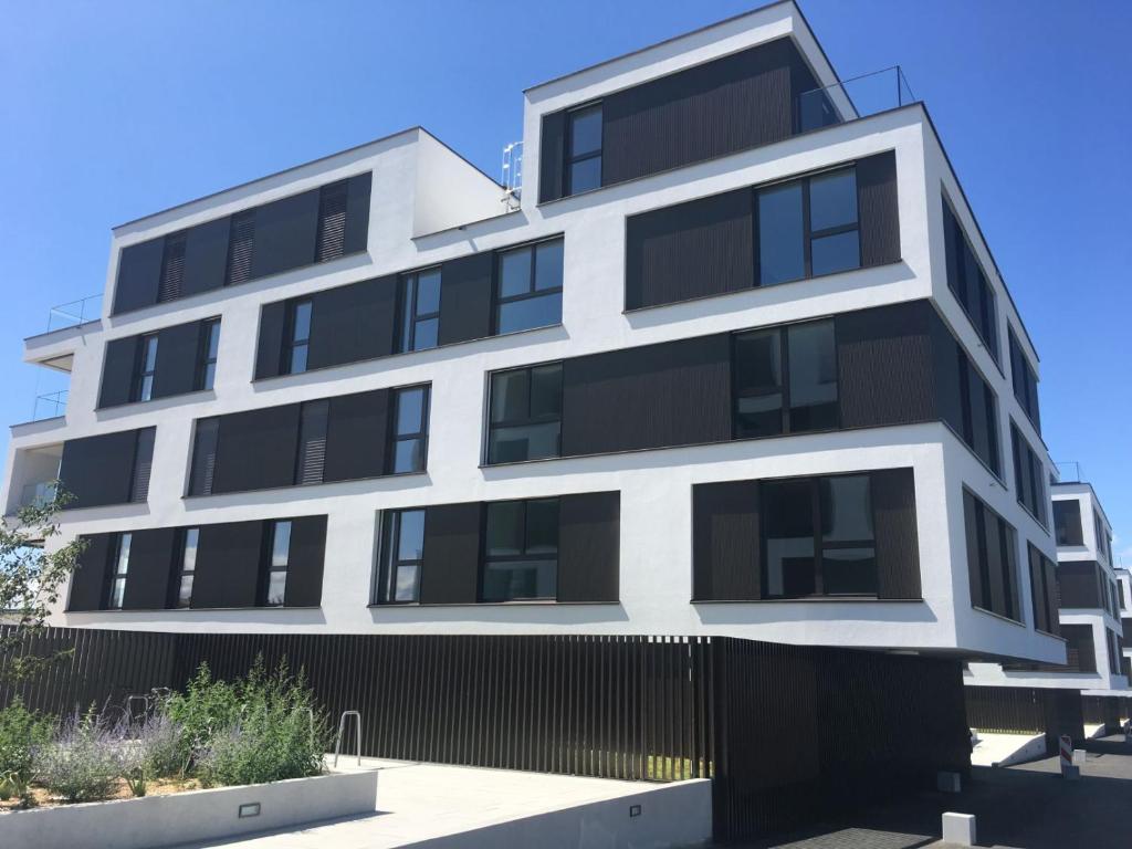 an apartment building with black and white windows at B&B Kelly Plus in Lausanne