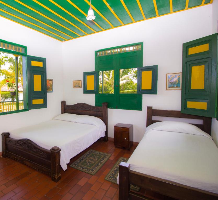 Postel nebo postele na pokoji v ubytování Finca Hotel el Palmar