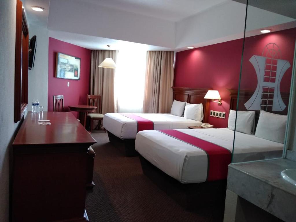 Postel nebo postele na pokoji v ubytování Hotel Lois Veracruz