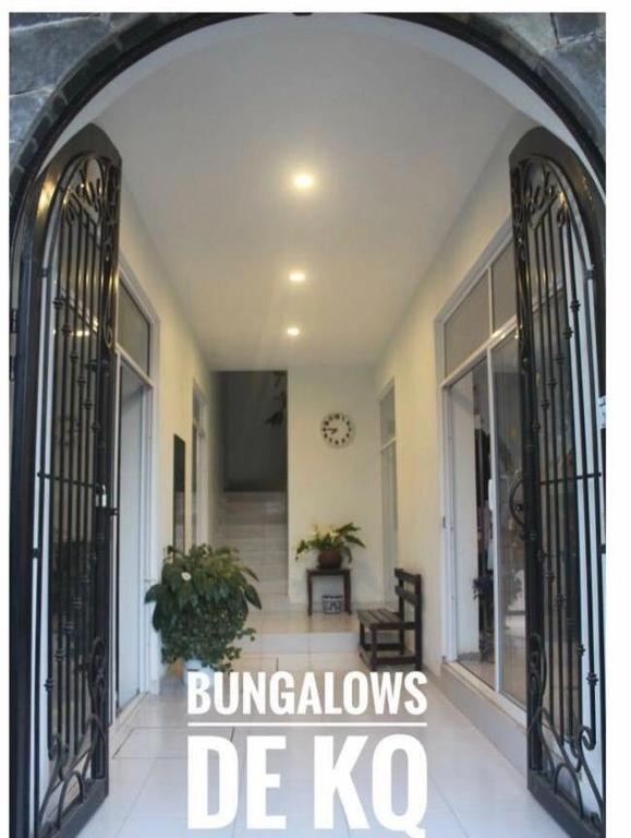 an entrance to a house with wrought iron gates at Bungalows de KQ in Xilitla