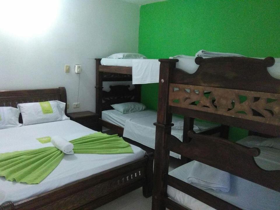 Postel nebo postele na pokoji v ubytování Hotel Mansión del Cesar