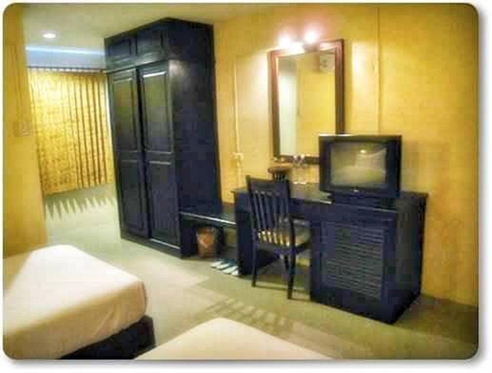 Postel nebo postele na pokoji v ubytování Chiangkhong Green Inn Resident