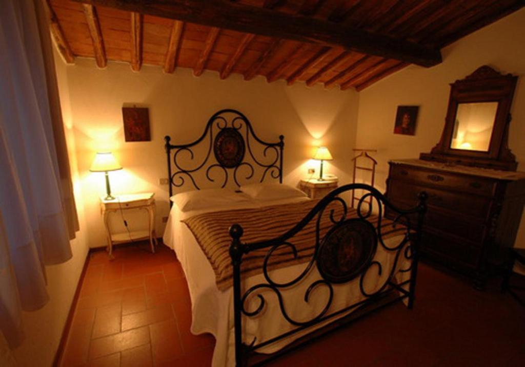 Postel nebo postele na pokoji v ubytování Albergo Il Colombaio