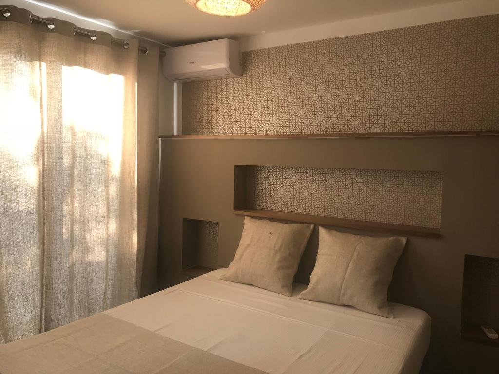 Postel nebo postele na pokoji v ubytování L'Olivine