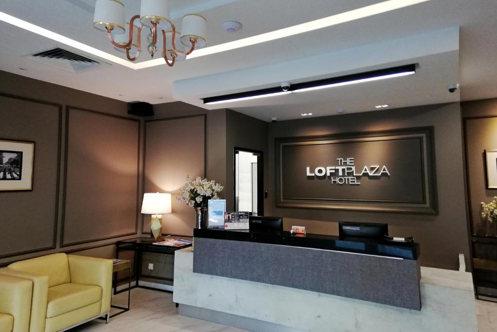 a lobby of a hotel with a reception desk at The Loft Plaza Hotel in Bangi