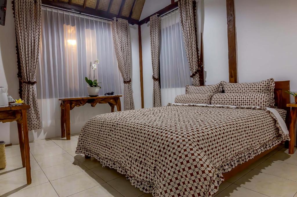 Letto o letti in una camera di The Omah Borobudur
