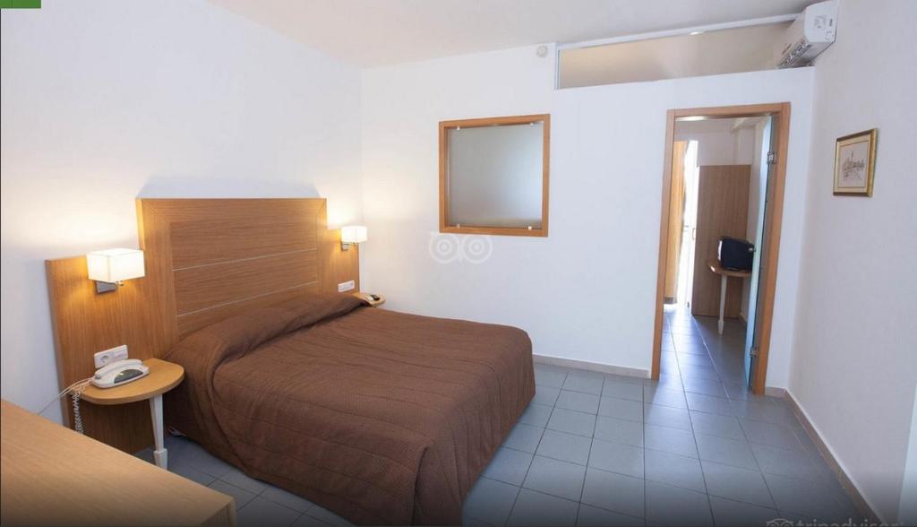 Postel nebo postele na pokoji v ubytování Sun Palace Hotel