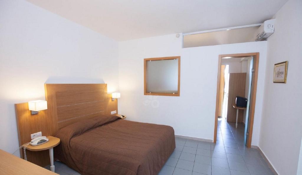 Postel nebo postele na pokoji v ubytování Sun Palace Hotel