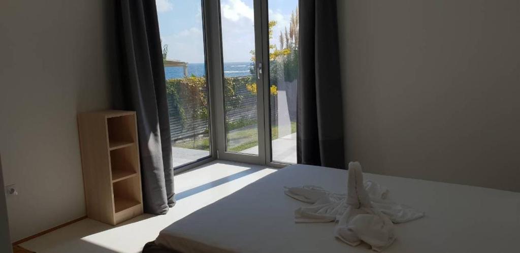 Postel nebo postele na pokoji v ubytování Villa Cape Vergoti