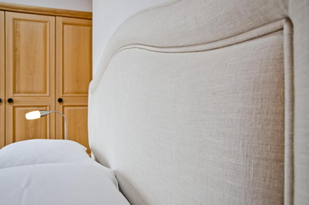 Postel nebo postele na pokoji v ubytování Apartment Bärgrose - GRIWA RENT AG