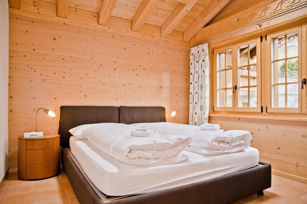 Postel nebo postele na pokoji v ubytování Apartment Bärgrose - GRIWA RENT AG