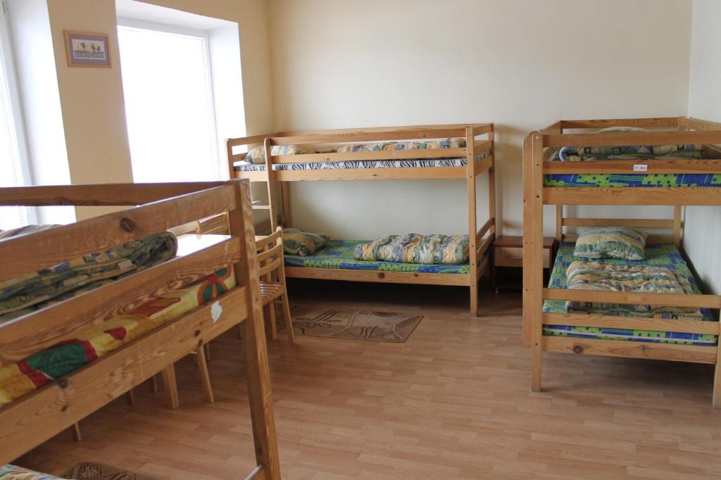 Postel nebo postele na pokoji v ubytování Fortuna Hostel