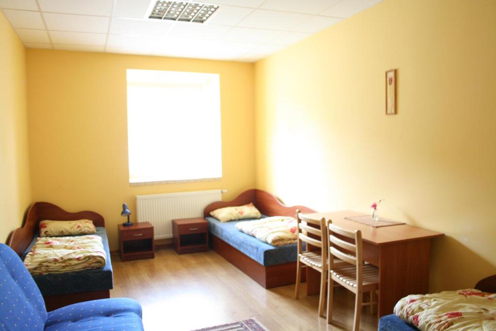 Postel nebo postele na pokoji v ubytování Fortuna Hostel