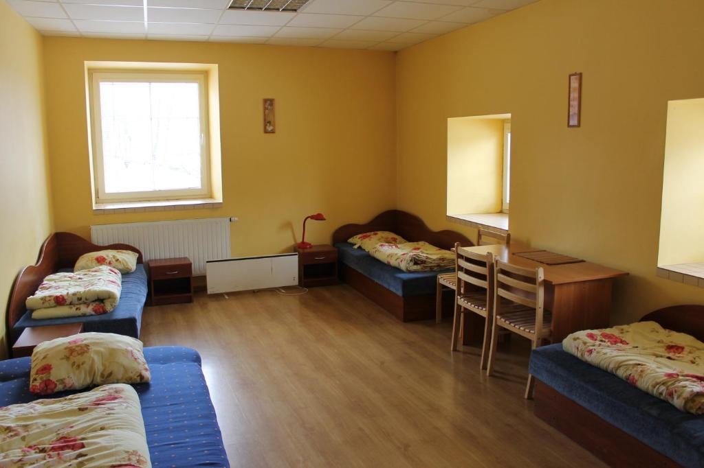 Postel nebo postele na pokoji v ubytování Fortuna Hostel