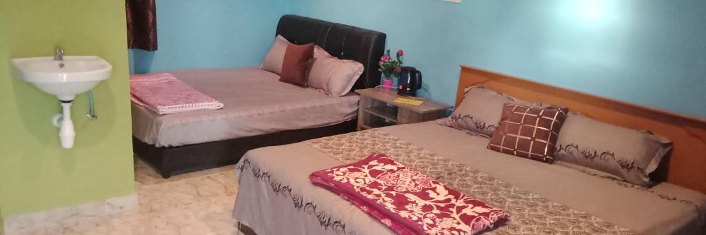 Postel nebo postele na pokoji v ubytování Mazza Nur Motel