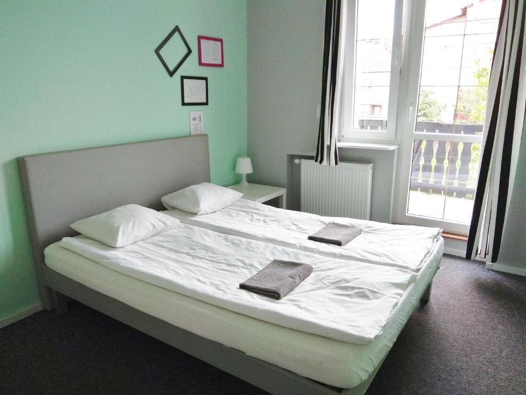 Postel nebo postele na pokoji v ubytování Olive Hostel