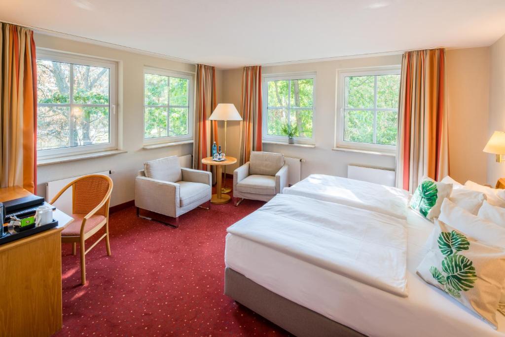 Postel nebo postele na pokoji v ubytování Parkhotel Diani