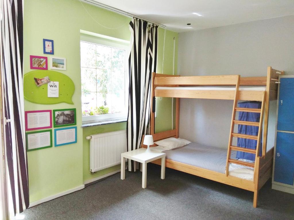 Postel nebo postele na pokoji v ubytování Olive Hostel