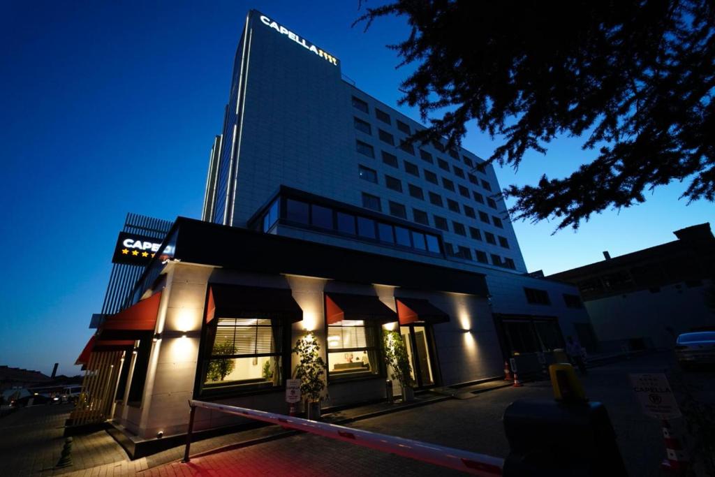 a building with a store front in front of it at Capella Otel in Eskisehir