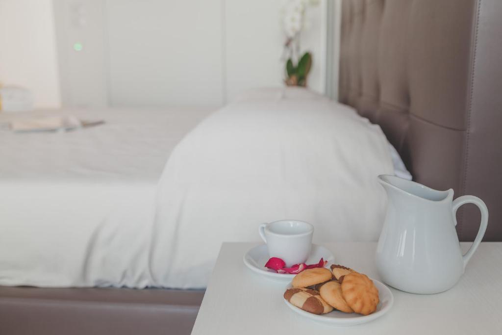A bed or beds in a room at Terra Ferma Rooms&More