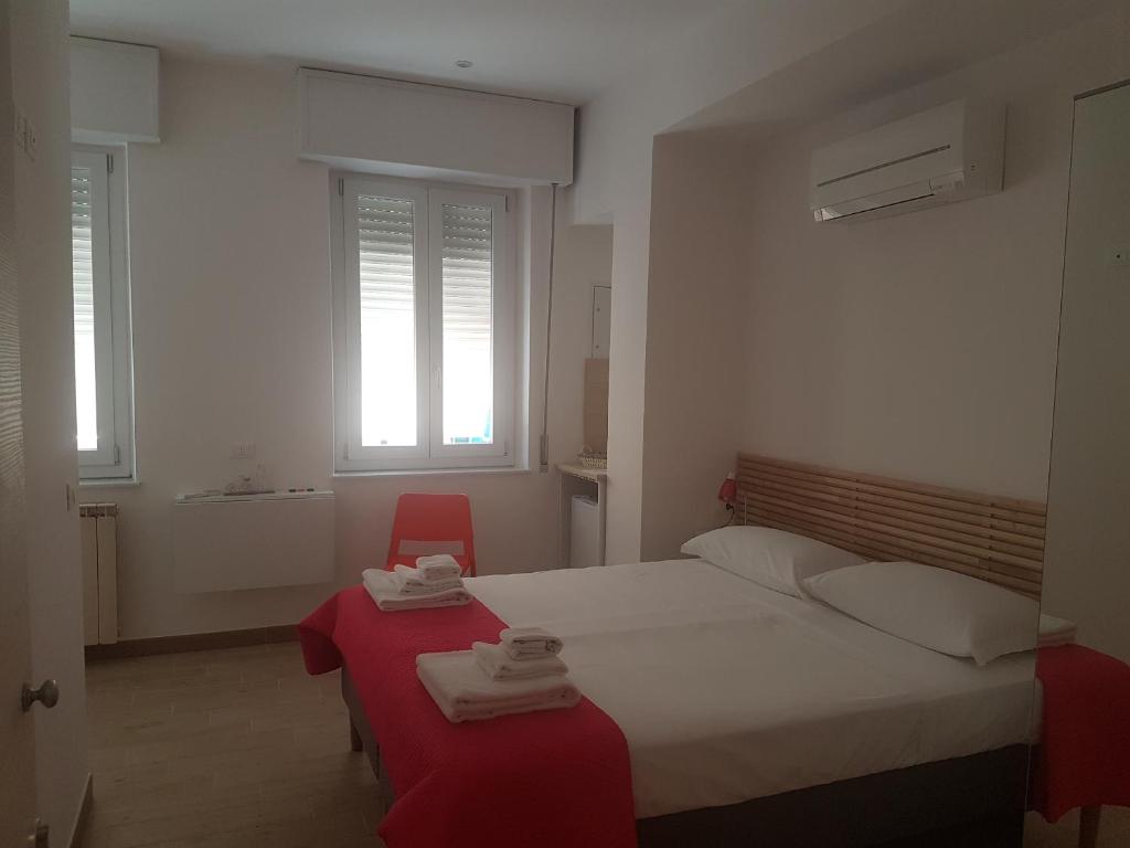 Postel nebo postele na pokoji v ubytování Parfumerie 5 Terre