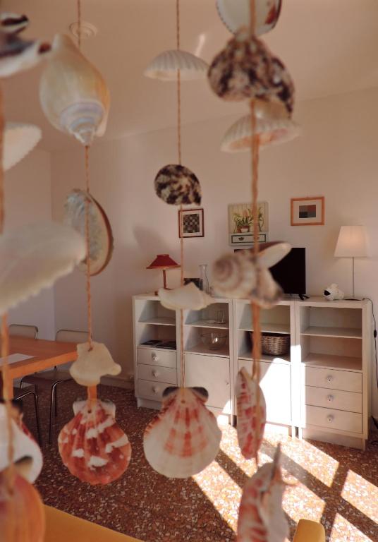 a room with many umbrellas hanging from the ceiling at Le Casasse "Paradiso" in Varigotti