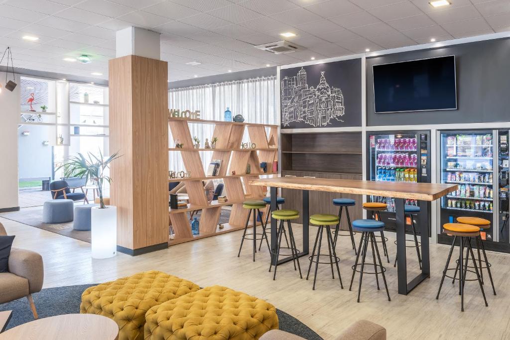 Posezení v ubytování Madrid Airport Suites, Affiliated by Meliá