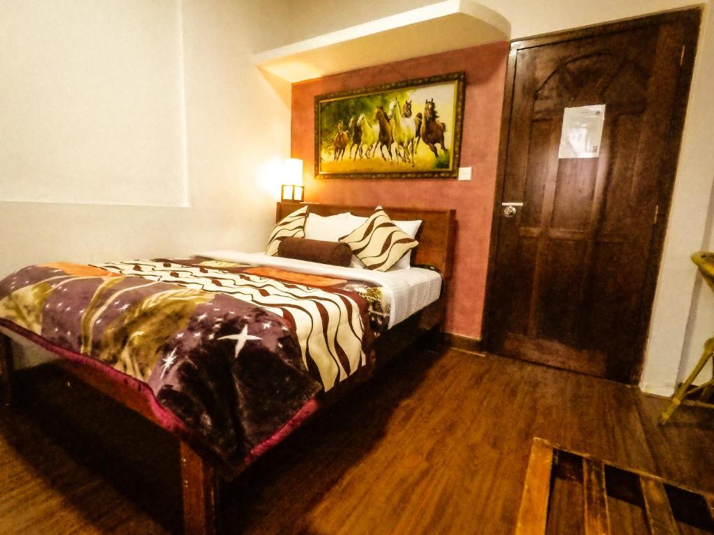 Postel nebo postele na pokoji v ubytování Nuwara Eliya Hills Rest