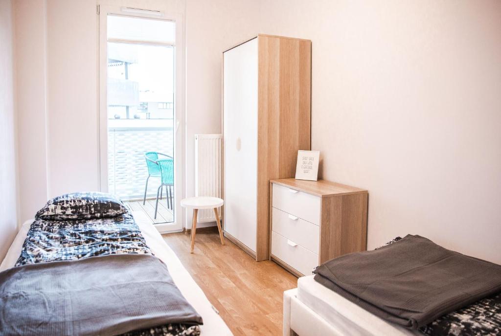 Posteľ alebo postele v izbe v ubytovaní Apartamenty City Tower od WroclawApartament-pl