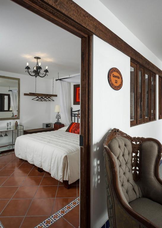 Postel nebo postele na pokoji v ubytování Hotel Tapalpa de Mis Amores
