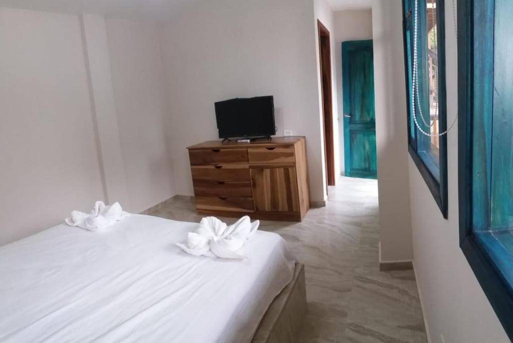 Postel nebo postele na pokoji v ubytování Canoa South Beach