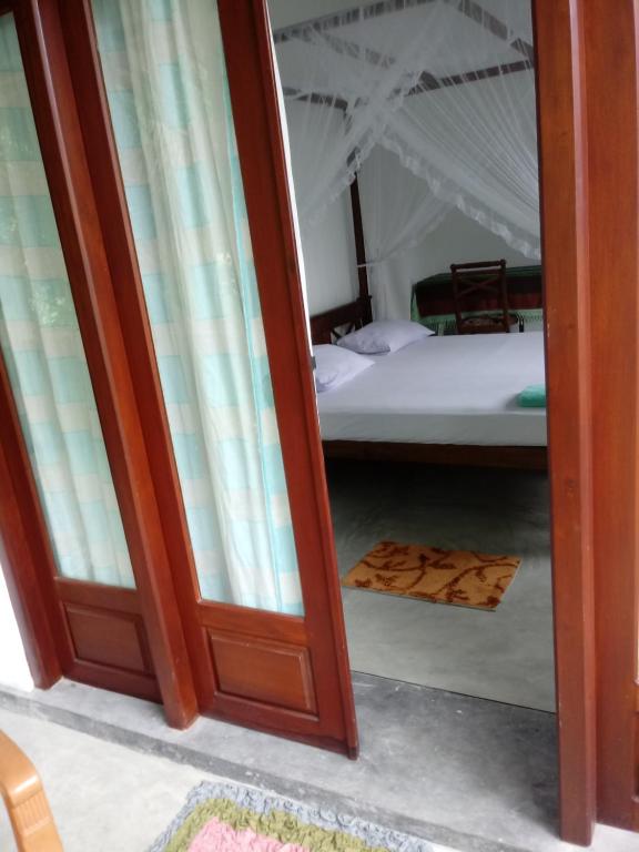 Postel nebo postele na pokoji v ubytování Unawatuna Backpacker Lodge