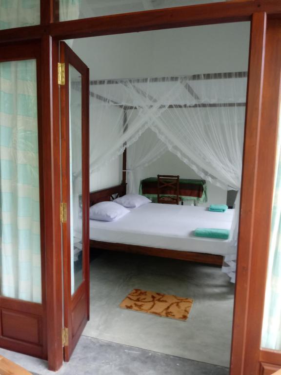 Postel nebo postele na pokoji v ubytování Unawatuna Backpacker Lodge