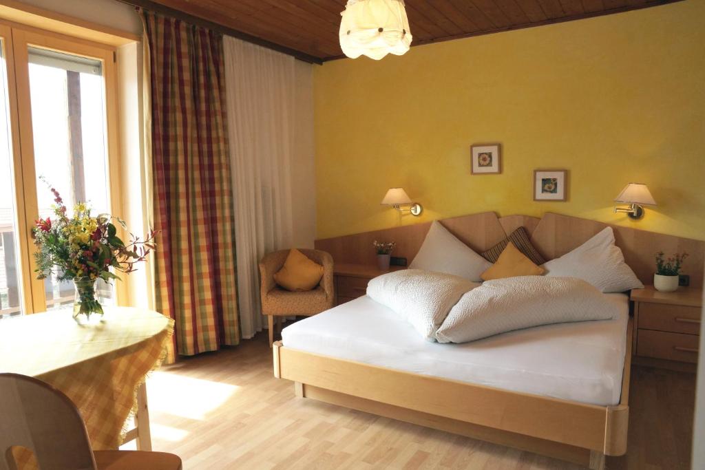 Postel nebo postele na pokoji v ubytování Alpenresidenz Maria