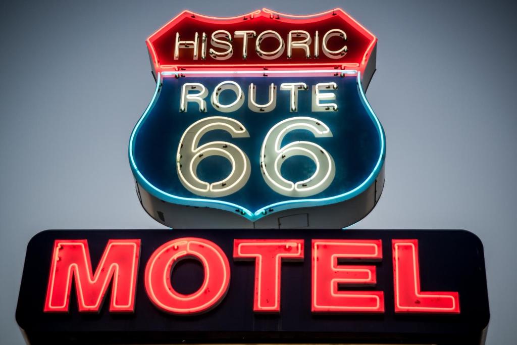 
a neon sign on a restaurant sign at Historic Route 66 Motel in Seligman

