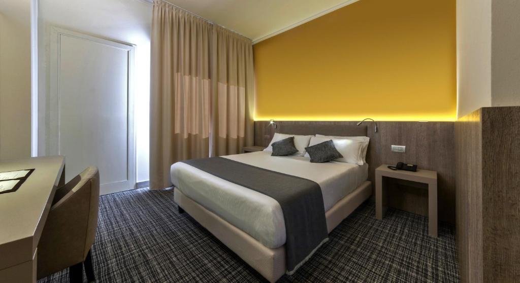 Postel nebo postele na pokoji v ubytování Living Hotel Milano