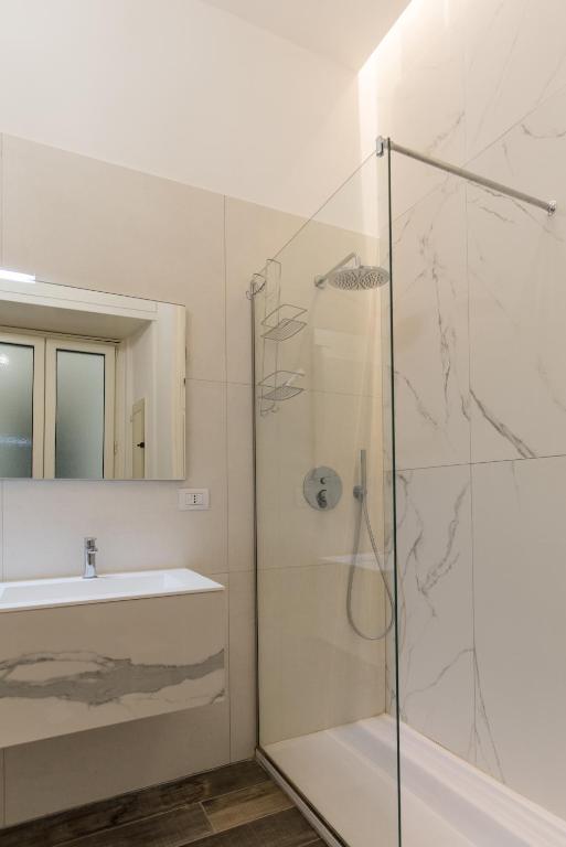 a bathroom with a shower and a sink at Relais Mareluna - Luxury Apartments in Salerno