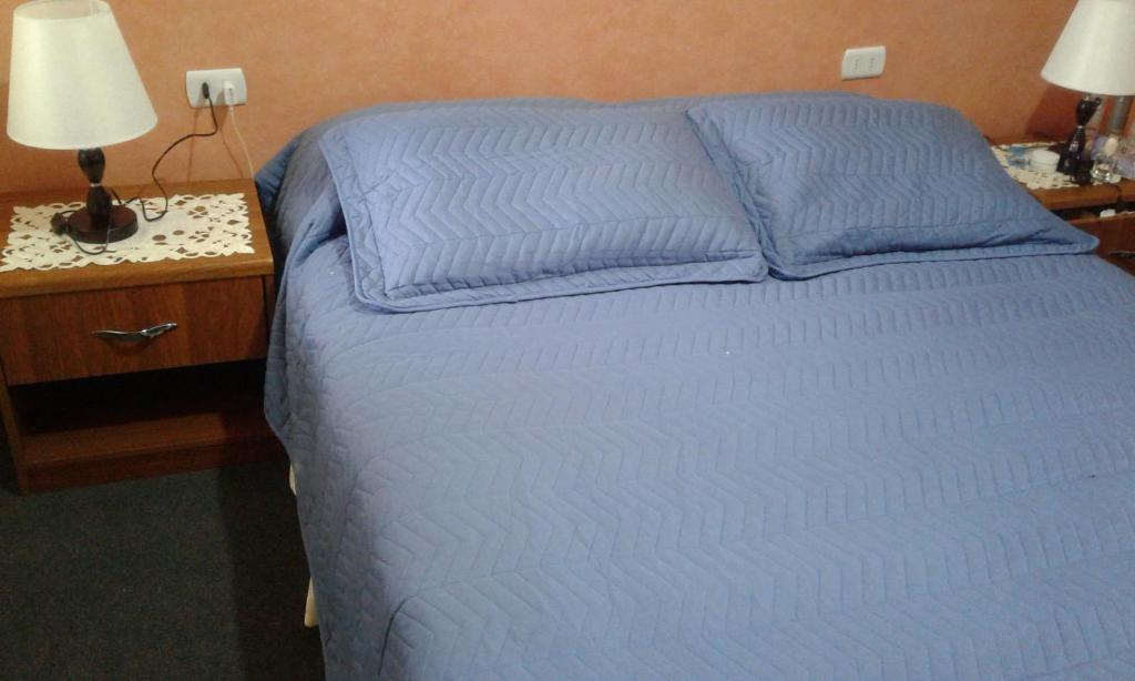 Postel nebo postele na pokoji v ubytování Hostal Don Pedro
