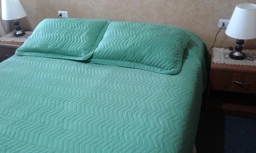 Postel nebo postele na pokoji v ubytování Hostal Don Pedro