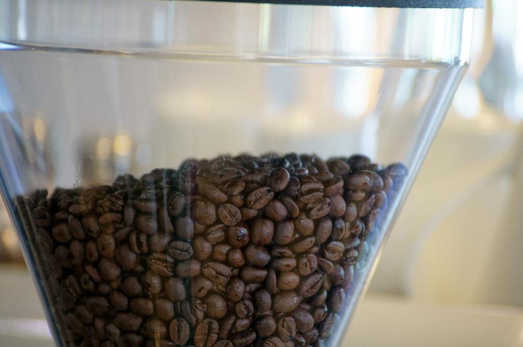 a glass filled with coffee beans sitting on a table at Taitung Venice B&amp;B in Taitung City