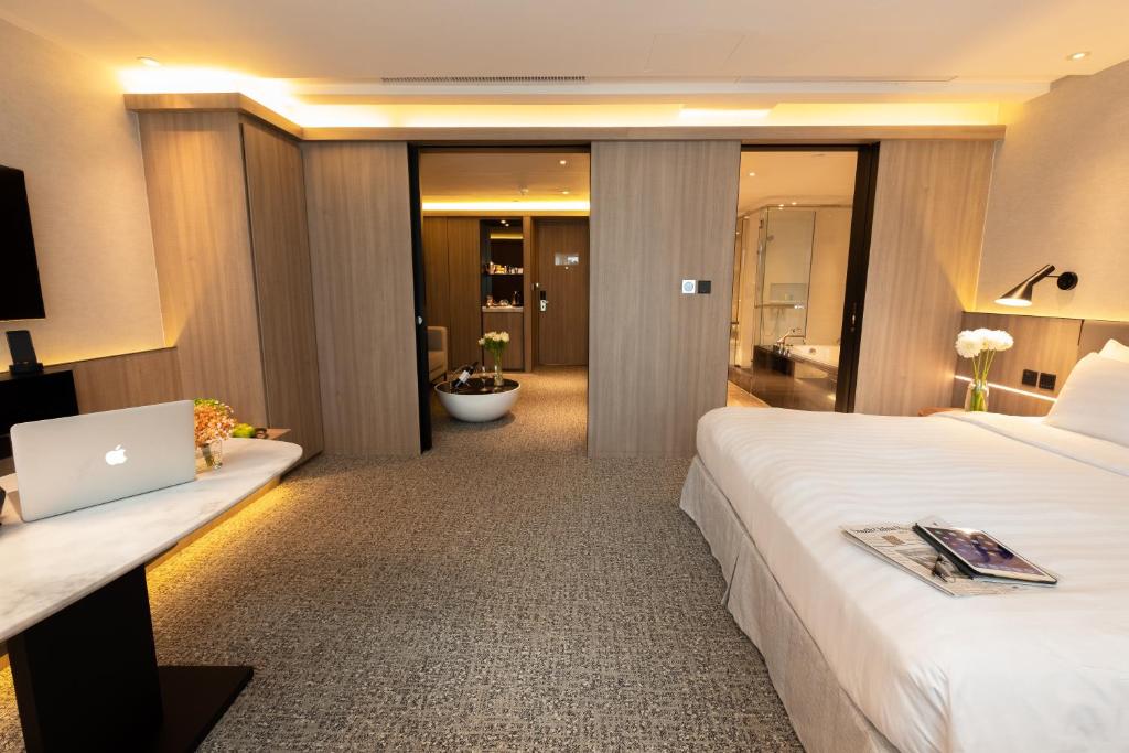 Postel nebo postele na pokoji v ubytování Nathan Hotel