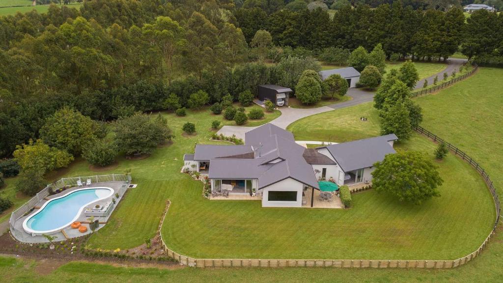 an aerial view of a house with a swimming pool at The Rise in Waimate North