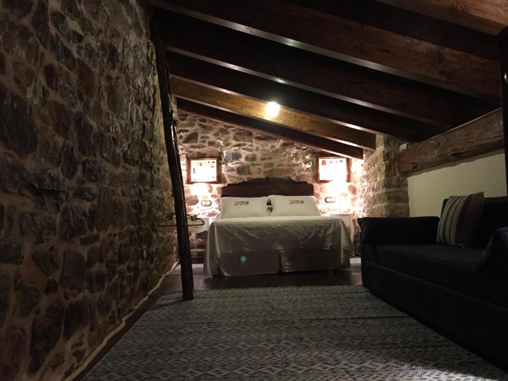 Postel nebo postele na pokoji v ubytování El Leñero del Tío Ramón