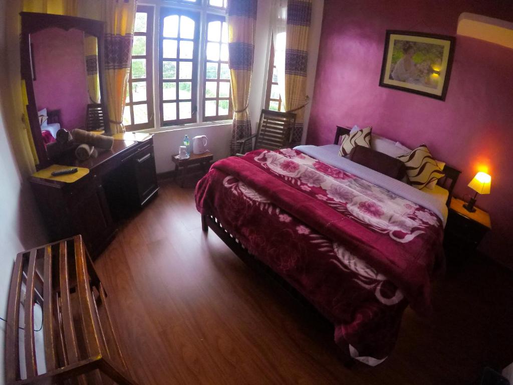Postel nebo postele na pokoji v ubytování Nuwara Eliya Hills Rest